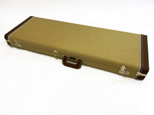 Rectangular tweed guitar case with brown leather corners and handle, metal latches, and white stitching on a white background.