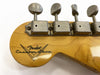 Close-up of vintage Fender Custom Shop guitar headstock with vintage tuners and natural wood finish
