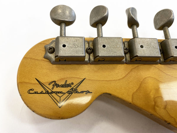 Close-up of vintage Fender Custom Shop guitar headstock with vintage tuners and natural wood finish