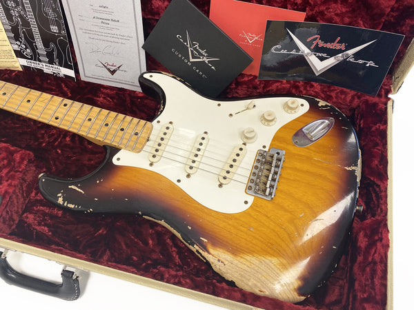 Fender Custom Shop 58 Stratocaster Relic electric guitar in sunburst finish with maple neck inside a red velvet lined hard case, accompanied by Fender Custom Shop certificates and manuals