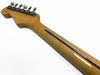 Back view of Coffee House Guitars electric guitar neck with vintage tuners and signature on headstock, showing smooth natural wood grain finish and visible truss rod channel.