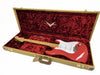 Fender Custom Shop red electric Stratocaster guitar with maple neck in vintage tweed hardshell case with plush red interior lining.