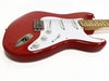 Red electric guitar with white pickguard and maple neck on white background