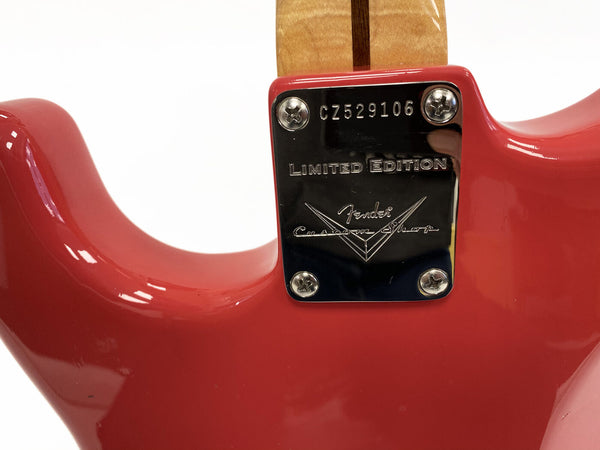 Close-up of red Fender Custom Shop Limited Edition electric guitar neck plate with serial number CZ529106