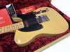 Fender American Original Series 50's Telecaster electric guitar in butterscotch blonde finish with black pickguard, maple neck, and chrome hardware displayed in a red plush-lined guitar case with Fender branded tags and booklets.