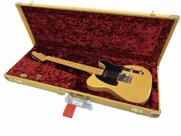 Fender Telecaster electric guitar with natural wood finish and black pickguard in tweed hard case with red plush interior lining