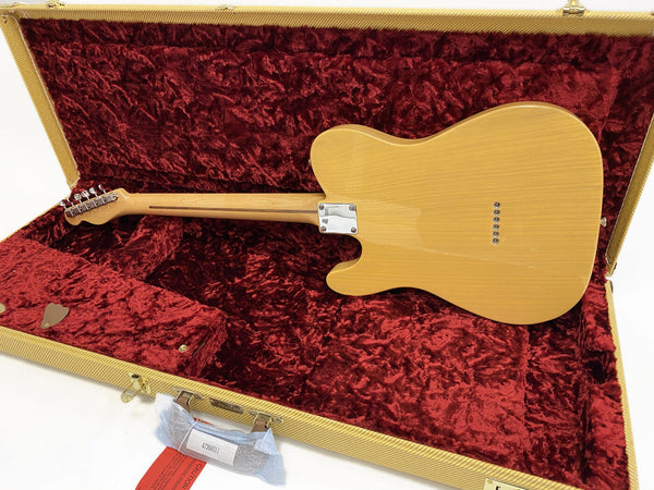 Back view of natural finish electric guitar with bolt-on neck inside plush red velvet-lined yellow tweed hard case for electric guitar storage and protection