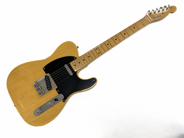 Fender Telecaster electric guitar with maple neck and black pickguard, natural finish, full body view on white background