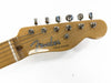 Close-up of maple guitar headstock with chrome tuning pegs featuring Fender Telecaster logo on a white background