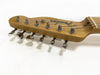 Close-up of Fender Telecaster natural wood guitar headstock with chrome tuning pegs and strings against white background