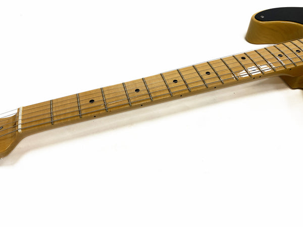 Close-up of maple neck and fretboard on electric guitar with black pickguard, isolated on white background