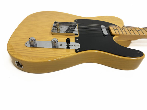 Butterscotch blonde electric guitar with black pickguard and chrome hardware on white background