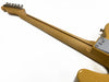 Maple neck and headstock of a yellow electric guitar with chrome tuning pegs and a skunk stripe on the back of the neck against a white background.