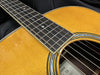 Close-up of Yamaha LL-TA acoustic guitar spruce top, rosewood fretboard, and abalone rosette detail