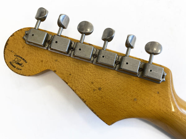 Vintage Fender Stratocaster guitar headstock with six vintage Kluson tuning pegs, custom-built maple neck with visible wear and Fender USA logo.