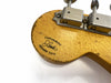 Close-up of Fender Custom-Built guitar headstock with vintage tuners and J. Smith signature on worn wood finish
