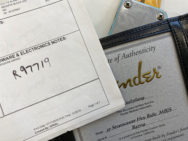 Close-up of Fender certificate of authenticity and hardware & electronics notes for 1957 Stratocaster Heavy Relic MBJS guitar with serial number R97719