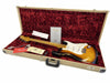 Fender vintage sunburst Stratocaster electric guitar with maple neck and white pickguard in open beige hard case with red plush interior, Fender certificate of authenticity, owner's manual, and guitar accessories.