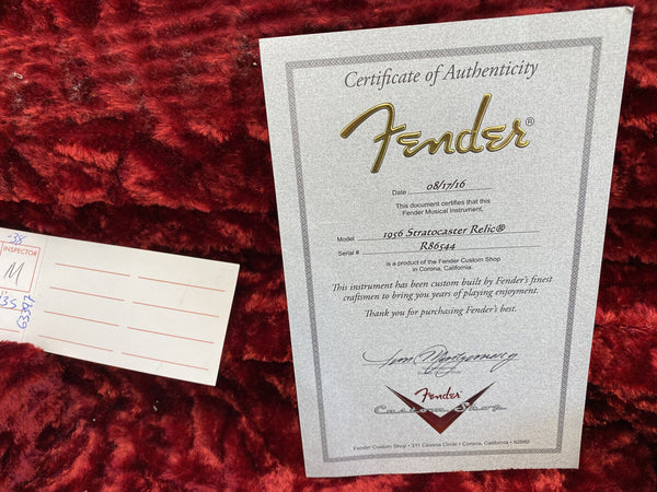 Fender Certificate of Authenticity for 1956 Stratocaster Relic guitar with serial number R86544 dated 08/17/16 on red plush guitar case lining