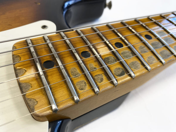 Close-up of aged maple guitar neck with worn fretboard and metal frets, electric guitar detail from Coffee House Guitars collection