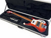 Rickenbacker 4001 electric bass guitar in red sunburst finish with chrome hardware and white pickguard in black plush-lined hardshell case with accessories