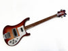 Rickenbacker electric bass guitar in sunburst finish with white pickguard, chrome hardware, and four control knobs on white background
