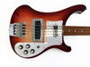 Vintage sunburst electric bass guitar with chrome hardware and four control knobs on white pickguard