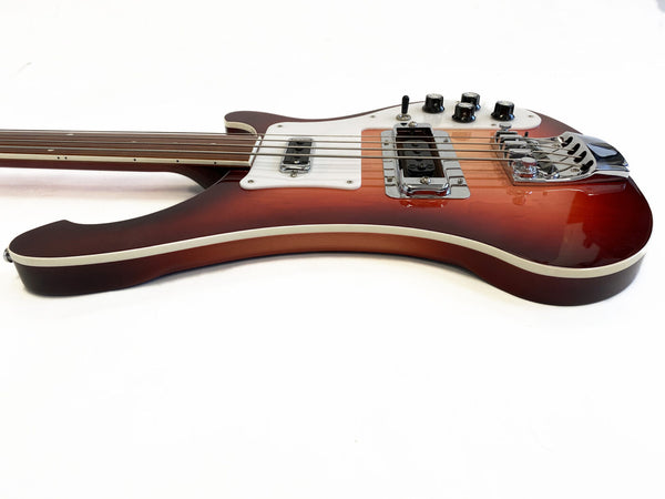 Vintage sunburst electric bass guitar with chrome bridge and control knobs on white background