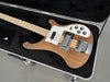 Vintage Rickenbacker 4001 bass guitar with natural wood finish and white pickguard in black plush-lined hard case