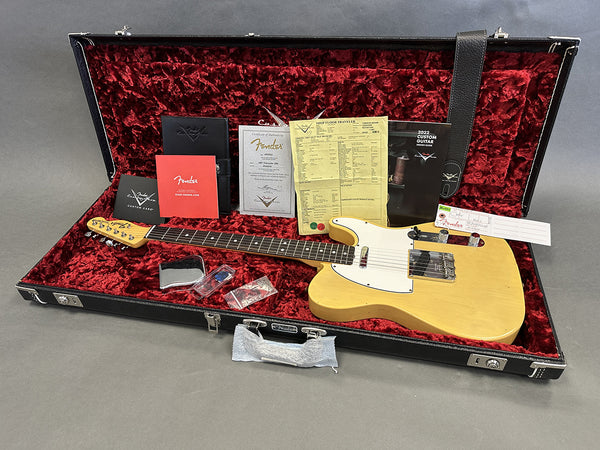 Fender 1957 Telecaster Blonde electric guitar in hardshell case with red velvet interior, Fender certificate of authenticity, custom care booklet, 2022 Fender Custom Guitar design guide, and assorted Fender tags and accessories