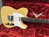 Vintage blonde Fender Telecaster electric guitar with white pickguard and chrome hardware in red plush Fender Custom Shop hard case interior