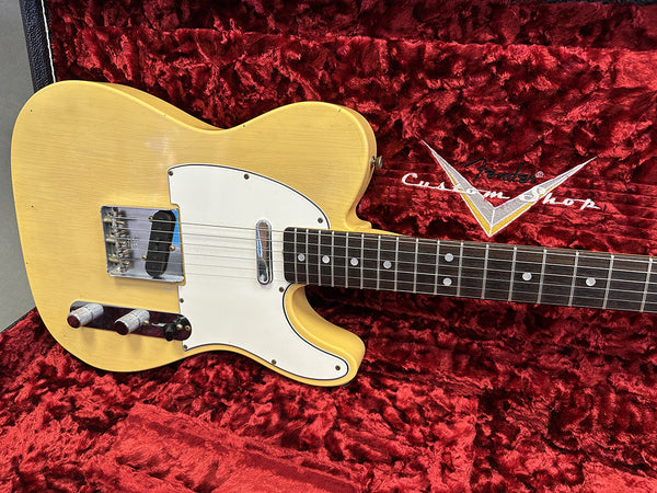 Vintage blonde Fender Telecaster electric guitar with white pickguard and chrome hardware in red plush Fender Custom Shop hard case interior