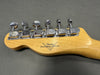 Fender Custom Shop guitar headstock with six chrome tuning pegs on natural wood finish background