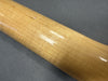 Glossy light brown maple guitar neck with wood grain texture on gray background