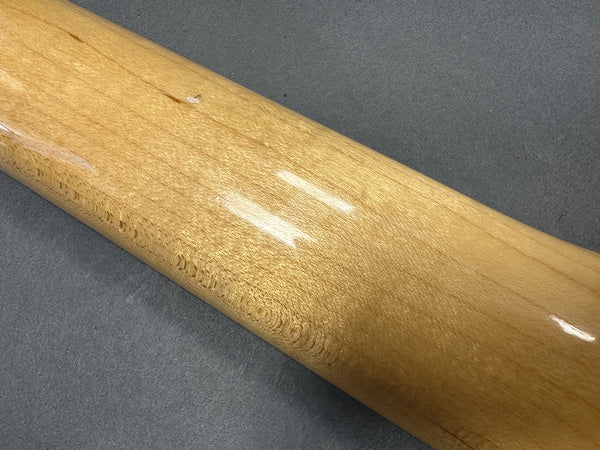 Glossy light brown maple guitar neck with wood grain texture on gray background
