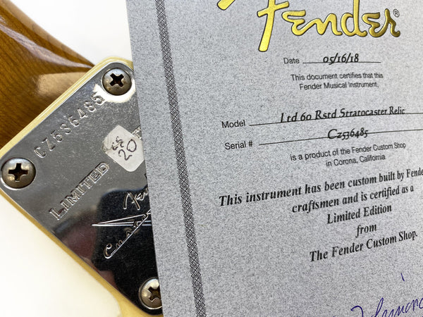 Close-up of Fender Limited Edition neck plate with serial number CZ536485 and accompanying Fender Custom Shop Limited Edition certificate for Ltd 60 Rstd Stratocaster Relic guitar dated 05/16/18.