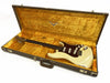 Vintage Fender Stratocaster electric guitar with white finish and tortoiseshell pickguard in original yellow plush-lined brown Fender case