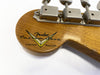 Close-up of Fender Custom Shop Limited Edition guitar headstock with vintage tuning pegs on natural wood finish