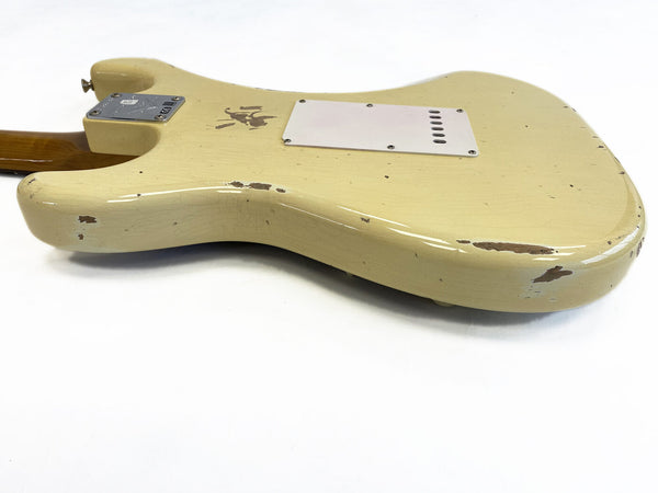 Vintage cream electric guitar body with worn and chipped paint finish, rear view showing tremolo cavity cover and neck plate on white background