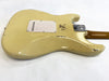 Vintage cream electric guitar body with worn finish and metal neck plate on white background, showing guitar back and neck heel