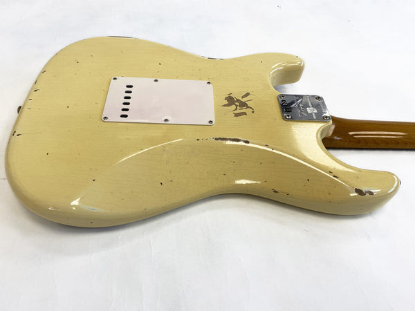 Vintage cream electric guitar body with worn finish and metal neck plate on white background, showing guitar back and neck heel