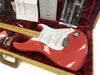 Fender Stratocaster NOS 2011 electric guitar in Fiesta Red finish with maple neck and white pickguard, displayed in tweed hard case with red plush interior, including Fender owner's manual and certificate of authenticity.