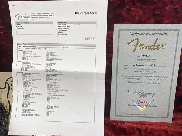 Fender Dealer Spec Sheet and Certificate of Authenticity for 1954 NOS Stratocaster Fiesta Red with Nitro Lacquer finish and Custom Shop Build details on red plush background.