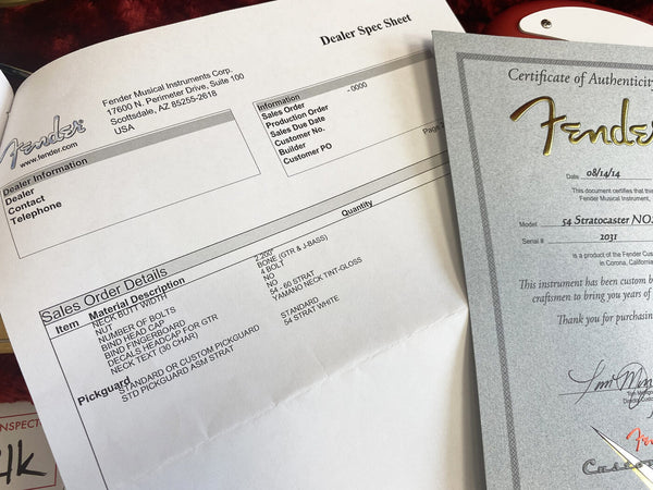 Fender Custom Shop Certificate of Authenticity and dealer sales order sheet for a 54 Stratocaster NOS guitar with Yamaha neck tint and custom pickguard details.