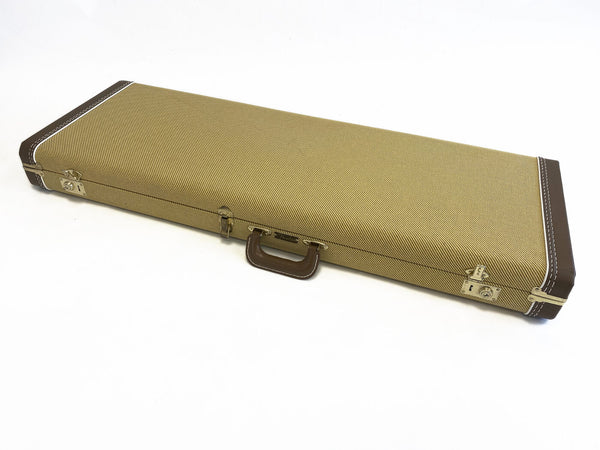 Fender tweed hard case for electric guitar with brown leather handle and corner reinforcements on white background