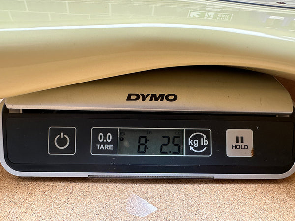 Close-up of digital scale showing guitar weight of 8 pounds 2.5 ounces at Coffee House Guitars