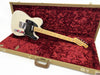 Fender Telecaster electric guitar with maple neck and black pickguard in open vintage-style tweed hard case with red plush interior