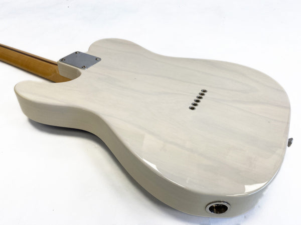 Glossy white solid body electric guitar back with string ferrules, metal neck plate, and maple neck on white background