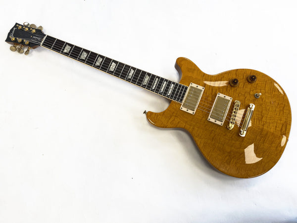 Used Ibanez Standard electric guitar with honey burst quilted maple top and dual humbucker pickups on white background
