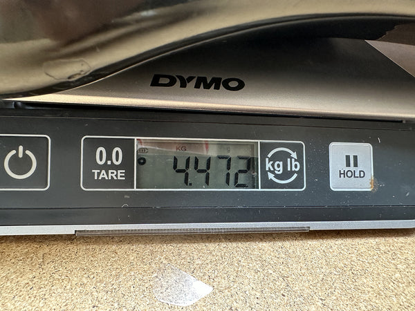 Digital scale displaying 4.472 pounds weight for Coffee House Guitars product measurement